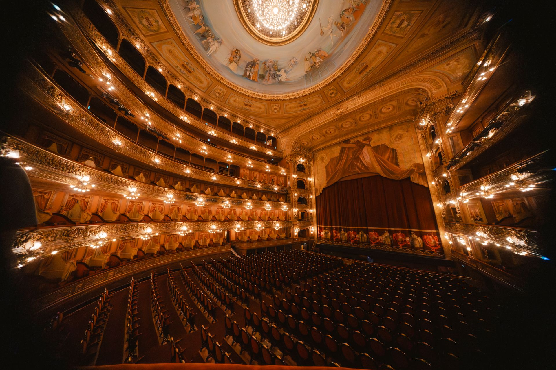 An ornate, warmly lit theater — the world of The Clarissa Yvonne Show